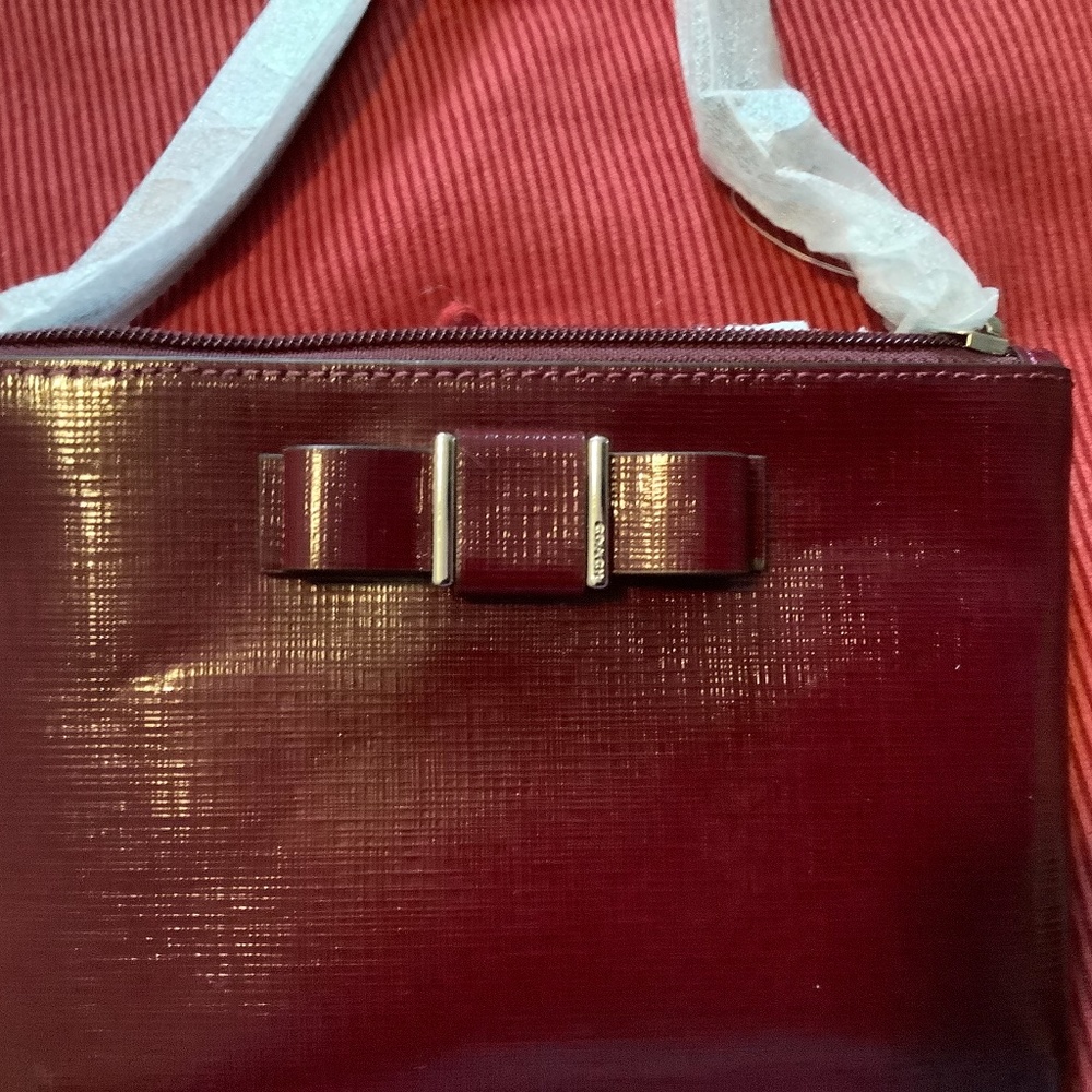 Coach wristlet with cute bow, glazed finish
